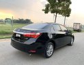 Toyota Camry  1.8GAT 2015 - Cần bán gấp Toyota Camry 1.8GAT đời 2015, màu đen