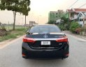 Toyota Camry  1.8GAT 2015 - Cần bán gấp Toyota Camry 1.8GAT đời 2015, màu đen