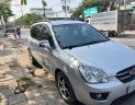 Kia Carens AT 2009 - Cần bán gấp Kia Carens AT sản xuất 2009, màu bạc, giá 298tr