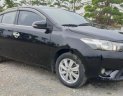 Toyota Vios 1.5E 2014 - Cần bán lại Toyota Vios E năm sản xuất 2014, màu đen, số sàn