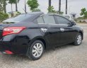 Toyota Vios 1.5E 2014 - Cần bán lại Toyota Vios E năm sản xuất 2014, màu đen, số sàn