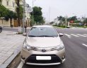 Toyota Vios 1.5E 2015 - Tôi cần bán chiếc xe ô tô Toyota Vios 1.5E màu ghi vàng, 2016