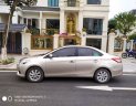 Toyota Vios 1.5E 2015 - Tôi cần bán chiếc xe ô tô Toyota Vios 1.5E màu ghi vàng, 2016