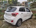 Hyundai Grand i10     2014 - Bán ô tô Hyundai Grand i10 sản xuất 2014, màu trắng, nhập khẩu nguyên chiếc