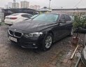 BMW 3 Series   2015 - Bán ô tô BMW 320i sản xuất 2015, màu đen, form 2016