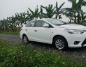 Toyota Vios 2014 - Gia đình cần bán Toyota Vios sản xuất 2014, màu trắng, mới đi được 10.000km