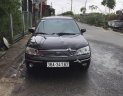 Ford Laser   2003 - Bán Ford Laser GHIA 1.8 MT sản xuất năm 2003, màu đen, 134 triệu