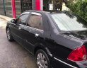 Ford Laser   2003 - Bán Ford Laser GHIA 1.8 MT sản xuất năm 2003, màu đen, 134 triệu