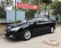 Toyota Camry  2.0E  2013 - Cần bán lại xe Toyota Camry 2.0E đời 2013, màu đen chính chủ, giá tốt