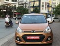 Hyundai Grand i10 1.0 AT 2014 - Cần bán xe Hyundai Grand i10 1.0 AT sản xuất 2014, màu nâu