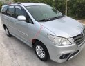 Toyota Innova 2014 - Cần bán Toyota Innova sản xuất 2014, màu bạc xe gia đình