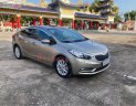 Kia K3   1.6 MT  2015 - Cần bán gấp Kia K3 1.6 MT đời 2015, màu vàng còn mới  