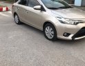 Toyota Vios   1.5 E  2015 - Cần bán Toyota Vios 1.5 E 2015, màu vàng