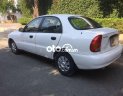 Daewoo Lanos 2004 - Cần bán xe Daewoo Lanos đời 2004, màu trắng