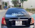 Daewoo Lacetti EX 1.6 MT 2005 - Cần bán lại xe Daewoo Lacetti EX 1.6 MT sản xuất 2005, màu đen, 135 triệu