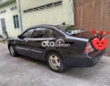 Daewoo Magnus 2004 - Cần bán lại xe Daewoo Magnus năm 2004, màu đen, giá 180tr