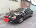 Daewoo Magnus 2004 - Cần bán lại xe Daewoo Magnus năm 2004, màu đen, giá 180tr