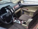 Toyota Camry 2014 - Cần bán gấp Toyota Camry 2.0E AT màu vàng đồng, năm sản xuất 2014, nguồn gốc rõ ràng, giấy tờ đầy đủ