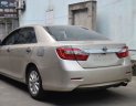 Toyota Camry 2014 - Cần bán gấp Toyota Camry 2.0E AT màu vàng đồng, năm sản xuất 2014, nguồn gốc rõ ràng, giấy tờ đầy đủ