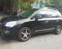 Kia Carens 2.0 2009 - Bán ô tô Kia Carens 2.0 năm 2009, màu đen còn mới, giá 245tr