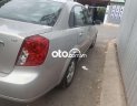 Chevrolet Lacetti  EX 1.6MT 2009 - Bán lại xe Chevrolet Lacetti EX 1.6MT sản xuất 2009, màu bạc xe gia đình