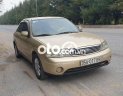 Ford Laser 2003 - Bán xe Ford Laser 1.8 năm 2003, màu vàng