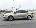 Kia K3 2014 - Cần bán gấp Kia K3 1.6AT sản xuất năm 2014, màu vàng cát, giá cạnh tranh