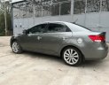 Kia Cerato 2009 - Bán Kia Cerato 1.6 số tự động sản xuất 2009, màu xám