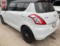 Suzuki Swift 2015 - Cần bán lại xe Suzuki Swift 1.4AT năm sản xuất 2015, màu trắng