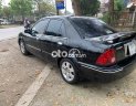 Ford Laser 2002 - Màu đen, giá 98tr