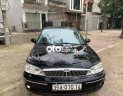 Ford Laser 2002 - Màu đen, giá 98tr