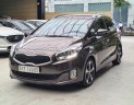 Kia Rondo 2015 - Số tự động, màu nâu, odo 77000km, biển TPHCM. Tặng 100% lệ phí trước bạ