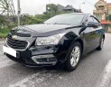 Chevrolet Cruze 2016 - Cần bán xe số sàn, màu đen còn mới ken