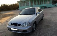 Daewoo Lanos SX 2001 - Cần bán lại xe Daewoo Lanos SX đời 2001, màu bạc giá 90 triệu tại Bình Dương