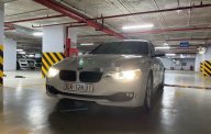 BMW 3 Series   2014 - Cần bán lại xe BMW 320i sản xuất 2014, màu trắng, xe nhập, giá 750tr giá 750 triệu tại Hà Nội