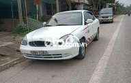 Daewoo Nubira 2003 - Cần bán gấp Daewoo Nubira sản xuất 2003, màu trắng xe gia đình giá cạnh tranh giá 62 triệu tại Quảng Nam