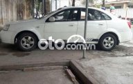 Daewoo Lacetti   EX  2005 - Cần bán Daewoo Lacetti EX đời 2005, màu trắng, xe nhập giá 115 triệu tại Tiền Giang