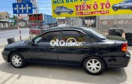 Kia Spectra 2002 - Cần bán xe Kia Spectra năm sản xuất 2002, màu đen chính chủ, 79tr giá 79 triệu tại Tiền Giang