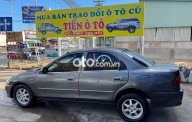 Mazda 323  GLX 1998 - Cần bán gấp Mazda 323 GLX năm sản xuất 1998, màu xám, giá chỉ 60 triệu giá 60 triệu tại Tiền Giang