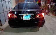 Toyota Corolla 1.8E MT 2004 - Cần bán Toyota Corolla 1.8E MT năm 2004, màu đen giá 128 triệu tại Kon Tum