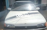 Bán ô tô Mazda 323 sản xuất 1995, màu trắng, nhập khẩu giá 30 triệu tại Sóc Trăng