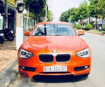 BMW 1 Series  116i  2014 - Chính chủ bán BMW 1 Series 116i đời 2014, màu cam