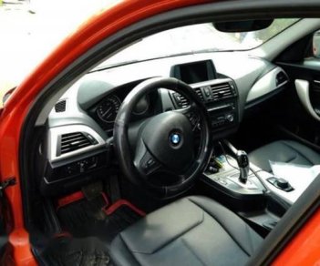 BMW 1 Series  116i  2014 - Chính chủ bán BMW 1 Series 116i đời 2014, màu cam