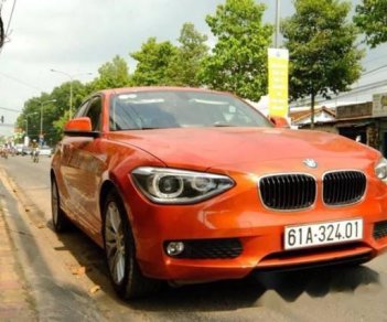 BMW 1 Series  116i  2014 - Chính chủ bán BMW 1 Series 116i đời 2014, màu cam