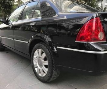 Ford Laser   Deluxe AT 2006 - Bán Ford Laser Deluxe AT đời 2006, màu đen xe gia đình, giá 265tr