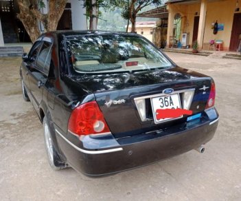 Ford Laser Ghia 1.8 MT 2004 - Bán xe Ford Laser Ghia 1.8 MT sản xuất năm 2004, màu đen, 200 triệu