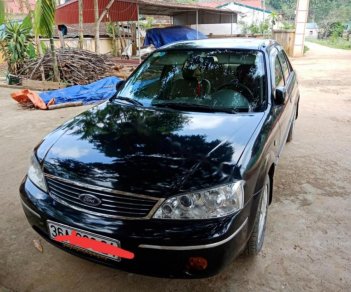 Ford Laser Ghia 1.8 MT 2004 - Bán xe Ford Laser Ghia 1.8 MT sản xuất năm 2004, màu đen, 200 triệu