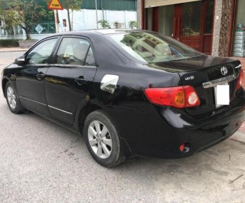 Toyota Corolla altis 1.8G MT 2009 - Bán Toyota Corolla altis 1.8G MT đời 2009, màu đen chính chủ giá cạnh tranh