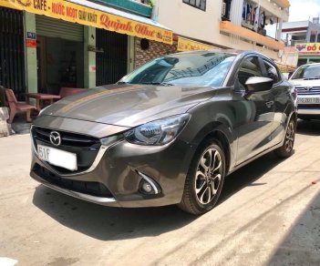 Mazda 2 AT 2016 - Bán Mazda 2 AT sản xuất năm 2016, màu nâu xe gia đình