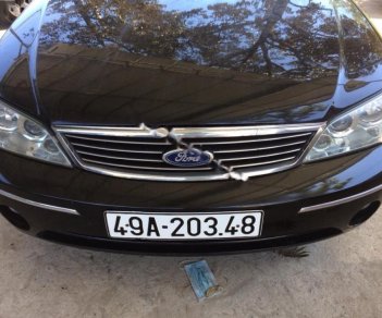 Ford Laser Ghia 1.8 AT 2005 - Bán Ford Laser Ghia 1.8 AT sản xuất 2005, màu đen xe gia đình, 235 triệu